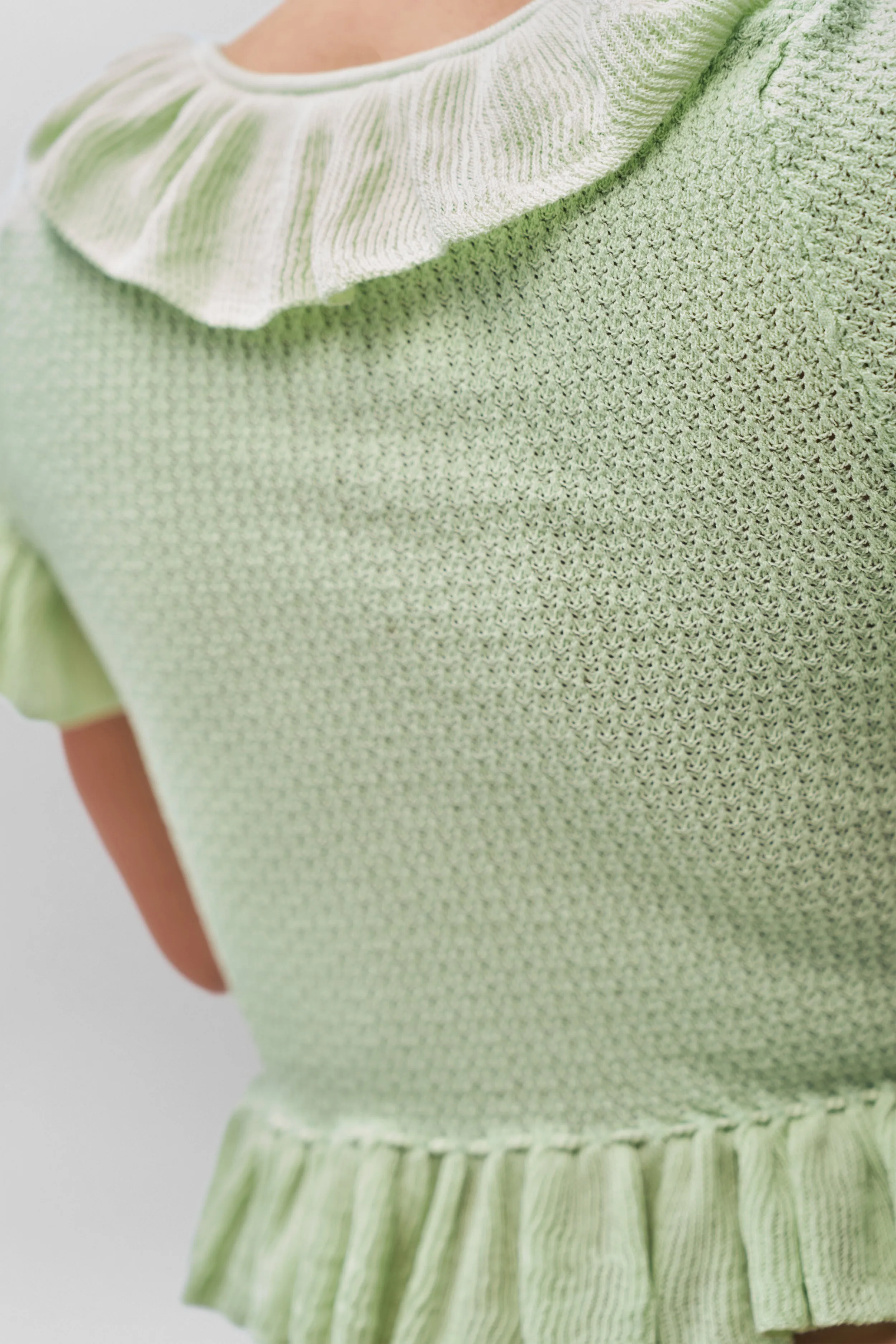 Multi Directional Mobility Ruffle Knit Tie Top